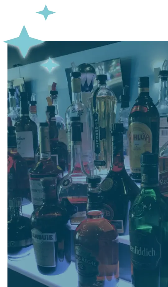 A vertical image of bottles of alcohol at the bar.